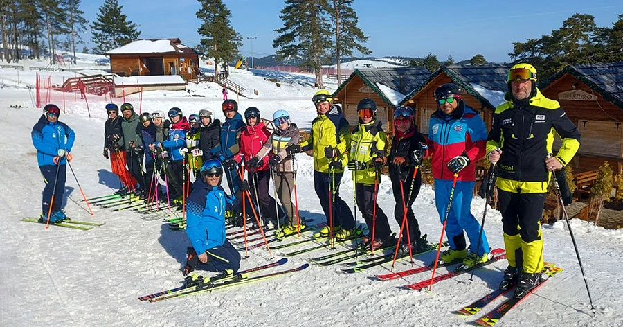 Ski teacher with kids