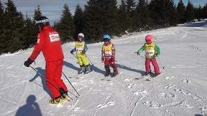 Ski teacher with kids